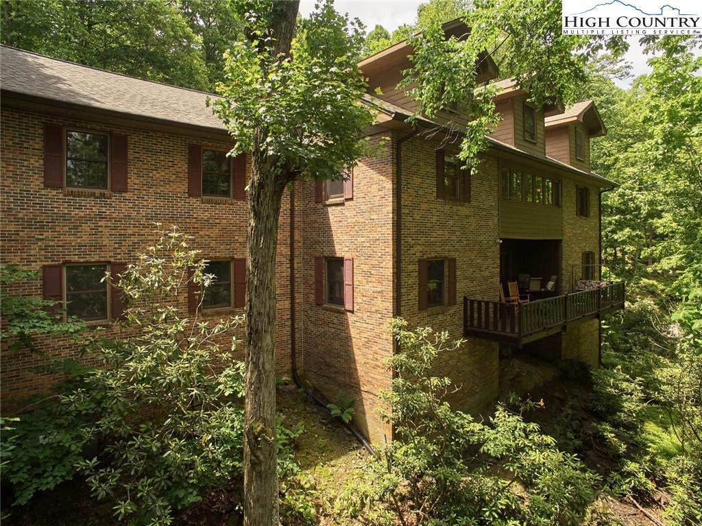 Covered entry and stained-wood siding at 239 Eagle Drive.